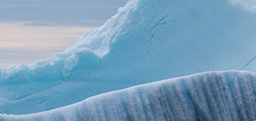 Photo of an iceberg and the Greenlandic nature.